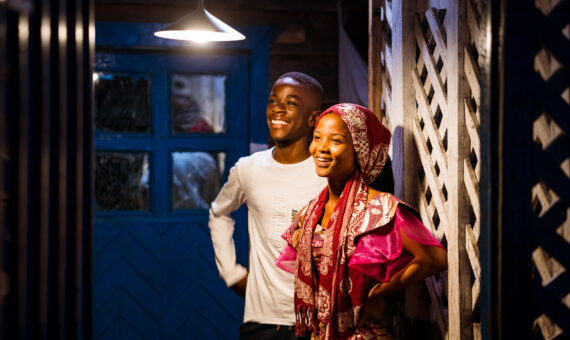 Photo: A family in the Democratic Republic of the Congo receiving light in their home from a solar-powered lamp – Altech