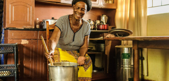 Modern Cooking Facility for Africa - Woman in Zambia using a clean cookstove