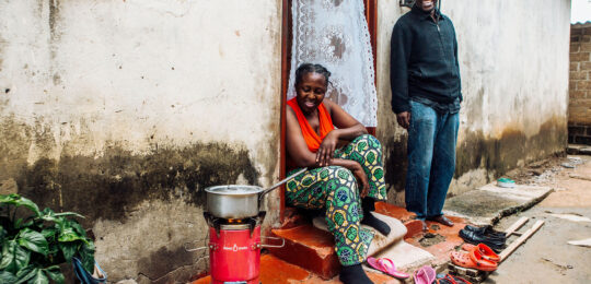 Photo: A woman using a Supamoto cookstove in Zambia – Emerging Cooking Solutions Zambia