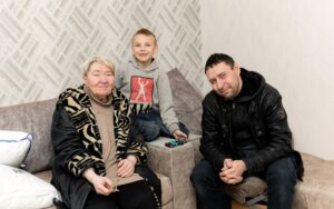 Tetiana Yelova with her son and grandson