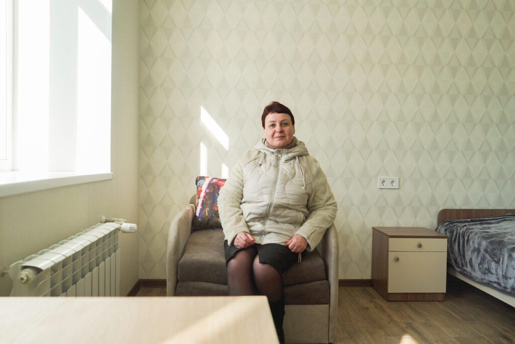 Alla, IDP living in the renovated urgent housing apartment building in Zvyahel.