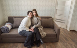Olena with daughter, IDP living in the renovated urgent housing apartment building in Zvyahel.